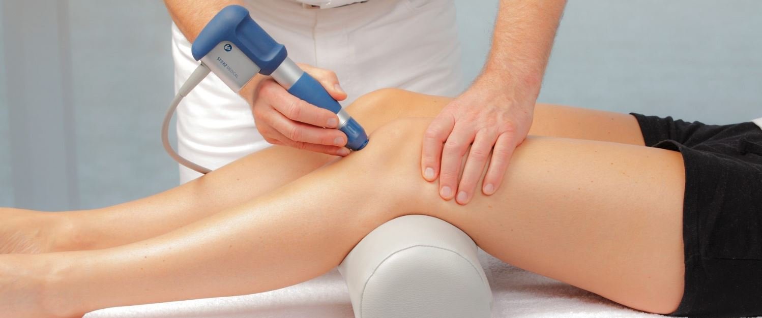 shockwave therapy on woman's knees